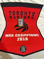 Full banner with plaque positioned on it showing design and scale