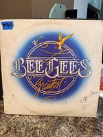 Front cover of Bee Gees "Greatest" LP showing artwork, wear and writing