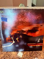 Front cover of Genesis “…And Then There Were Three…” LP in partial shrink wrap