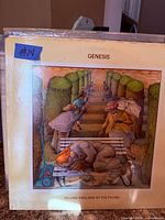 Front cover of Genesis Selling England by the Pound LP in plastic sleeve
