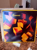 Front cover of Genesis self-titled vinyl LP showing artwork and condition