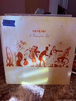 Front cover of Genesis “A Trick of the Tail” LP showing artwork and wear