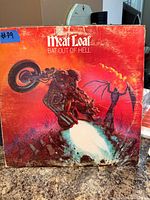 Front cover of Meat Loaf Bat Out of Hell LP showing overall wear