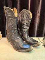 Full view of both boots standing to show overall style and condition