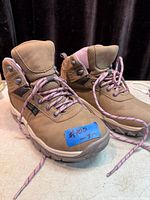 Front and side view of both boots showing overall appearance and laces