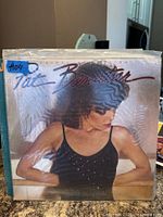 Front cover of Pat Benatar Crimes of Passion LP in plastic sleeve