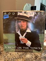 Front cover of Rod Stewart A Night on the Town LP showing wear