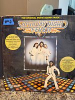 Front cover of Saturday Night Fever double LP soundtrack showing artwork and condition