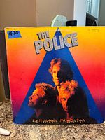 Front cover of The Police Zenyatta Mondatta LP with age wear visible