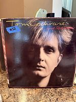 Front cover of Tom Cochrane and Red Rider vinyl LP showing sleeve condition