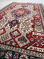 Oblique view showing full rug, central medallion and border