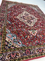 Full rug angled showing design and border