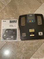 Scale and manual on floor