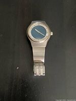 Front view of stainless steel Fossil wristwatch showing blue dial