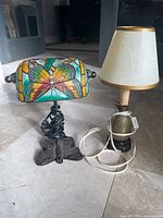 Front view of both lamps showing stained glass shade and pineapple lamp with shade