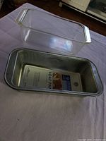 Top view of both loaf pans showing materials and size label