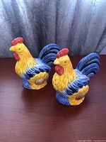 Both rooster salt and pepper shakers front view