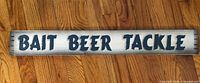 Front view of wood sign showing 'BAIT BEER TACKLE' text