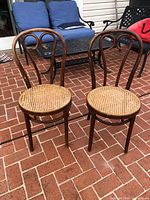 Full view of both bentwood chairs on patio