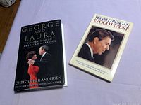 Both books front covers visible on tabletop