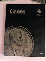 Front cover of Cents folder showing title and Whitman logo