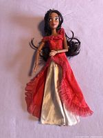 Full view of Elena of Avalor doll in red dress