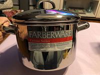 Full view of Farberware stainless stockpot with lid and label