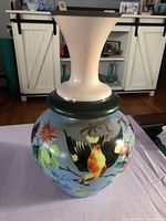 Front view showing full vase with bird and floral painting