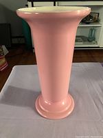 Front view of tall pink ceramic vase