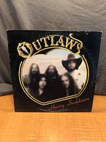 Front album cover showing title and band photo