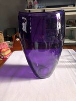 Front view of thick purple glass vase