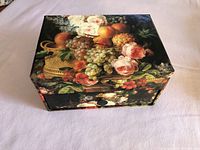 Top view of closed recipe box showing still-life artwork