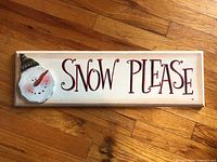 Full view of wooden Snow Please sign on wood floor