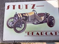 Front of metal sign showing Stutz Bearcat graphic and text