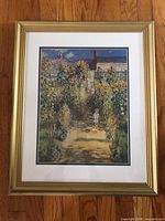 Full view of framed Monet print showing mats and frame