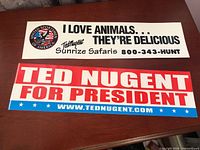 Front view of both bumper stickers showing designs and text