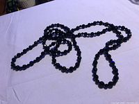 Necklace coiled to show overall length and bead style