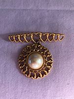 Front view showing heart bar and faux pearl pendant