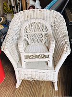Front view of child rocking chair with doll chair placed on seat