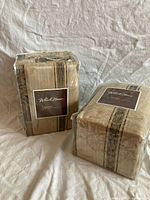 Front view of two sealed WholeHome curtain packages