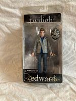 Front of sealed package showing Edward Cullen figure and accessory