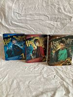 Front view of all three Ultimate Edition sets showing cover art and numbering 1, 2, 3