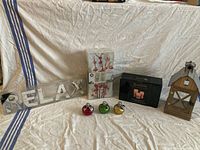 All items together: RELAX sign, lantern, boxed candle set, lighted canvas art, three ornaments