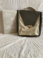 Front view of album and backpack