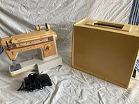 Singer sewing machine with case lid and foot pedal