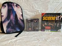 Backpack, fragrance gift set, and board game grouped