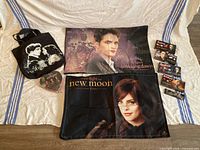 All items laid out showing tote, two throws, heart pack, four trading card boxes