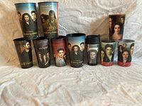 Group shot of ten Twilight plastic cups and one travel mug