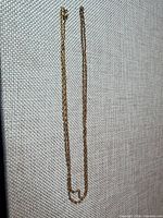 Full view of gold-filled chain laid flat