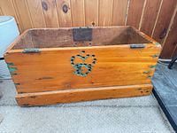 Front view showing heart motif, dovetail joints, hinge remnants